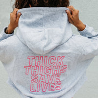 THICK THIGHS SAVE LIVES Crop Hoodie