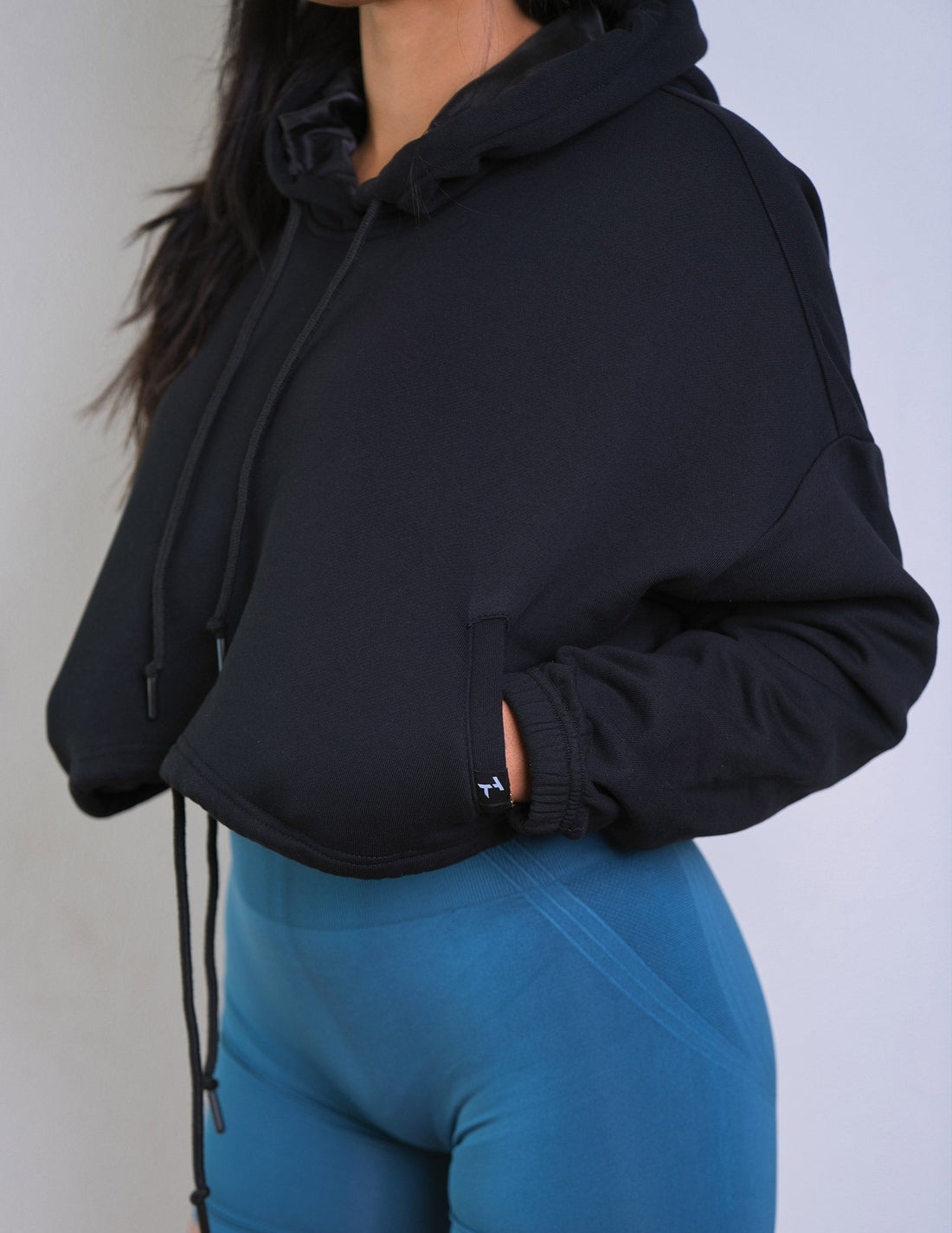 Model wearing Thick Athletics Crop Hoodie