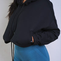 Model wearing Thick Athletics Crop Hoodie