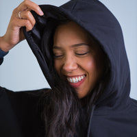 Model wearing Thick Athletics Crop Hoodie closeup of satin hood