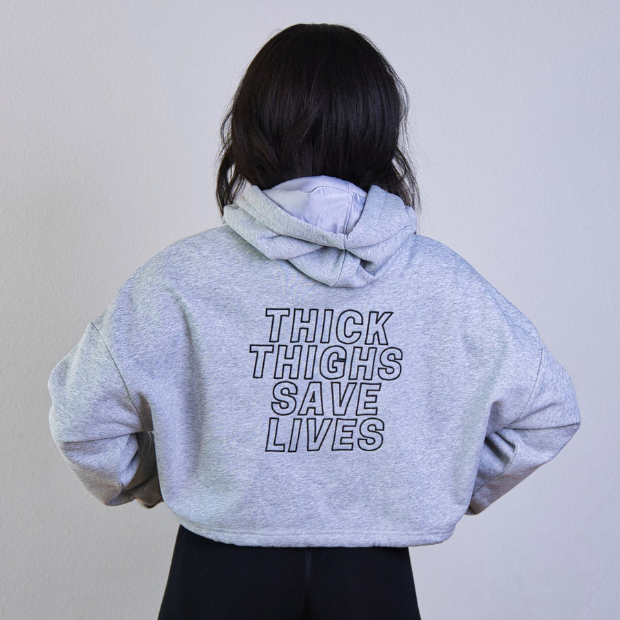 Model wearing Thick Athletics Crop Hoodie