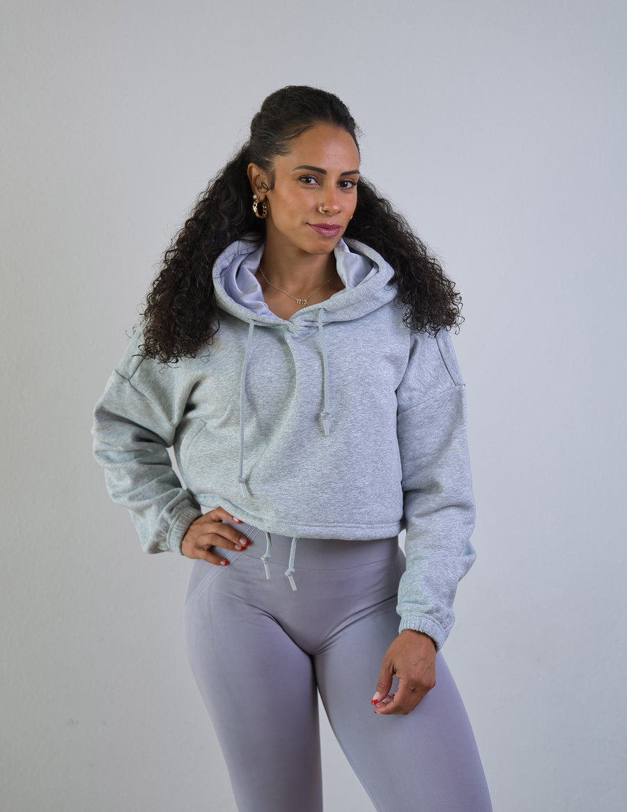 Model wearing Thick Athletics Crop Hoodie